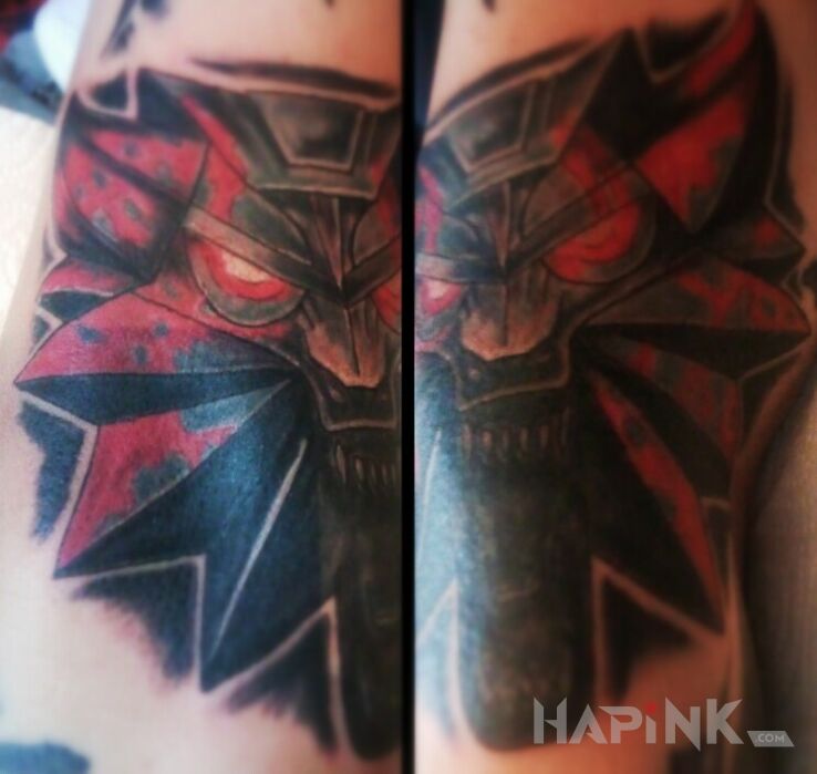 Tattoo Wiedźmin in demons motif on the forearm