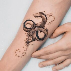 Tattoo Dragon of infinity On the arm motif: colorful style: graphic / illustrative