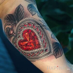 Tattoo Crystal heart on the bicep motif: objects style: realistic