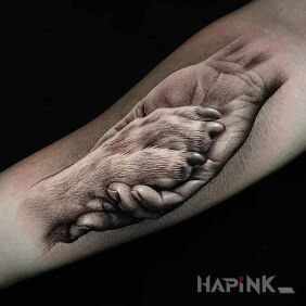Tattoo Friend's paw On the arm motif: black and gray style: realistic