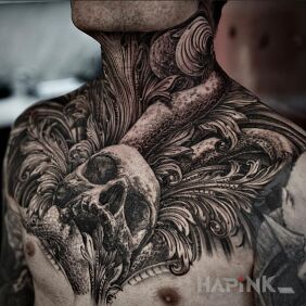 Tattoo Skull in leaves on the neck motif: black and gray style: realistic