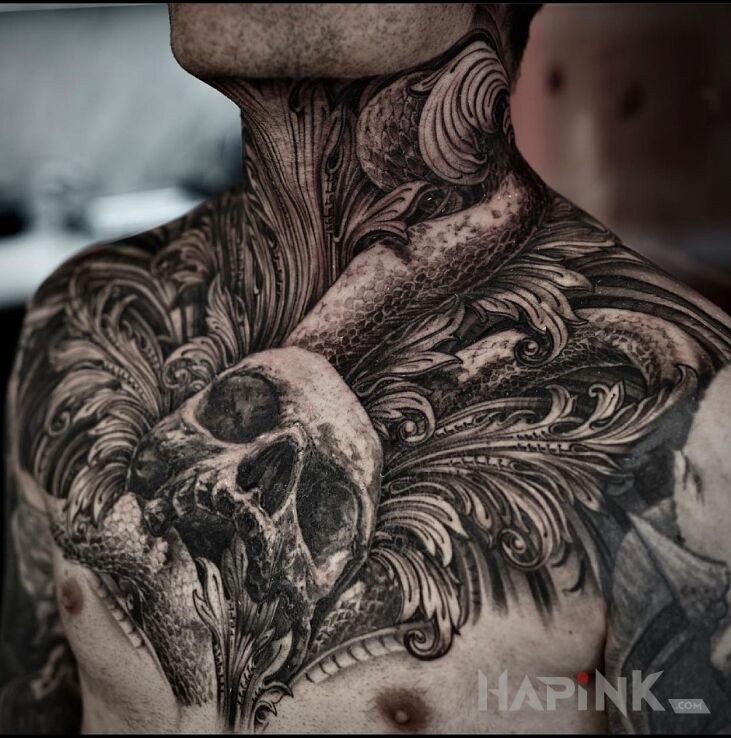 Tattoo Czacha w liściach in black and gray motif and realistic style on the collarbone