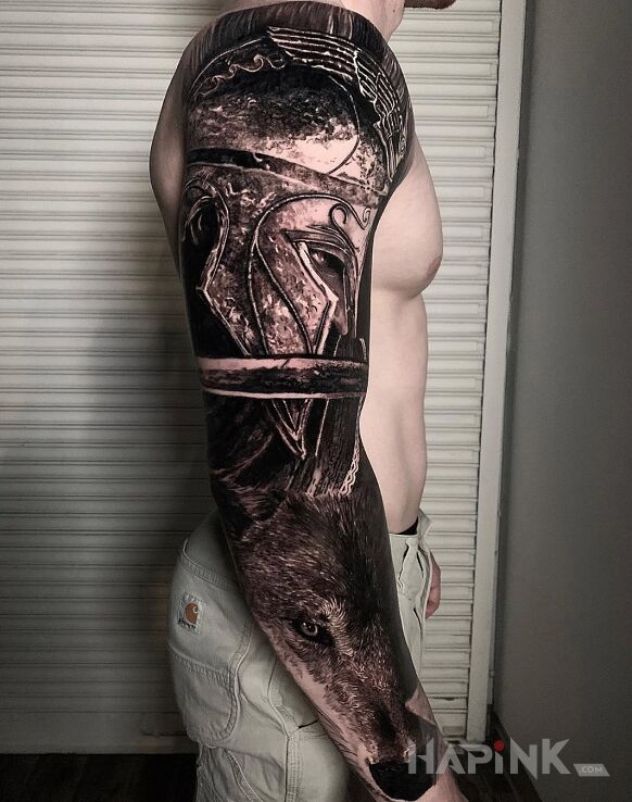 Tattoo Wojak na wilku in black and gray motif and realistic style On the arm