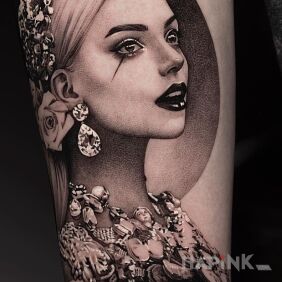 Tattoo Insane portrait On the arm motif: black and gray style: realistic