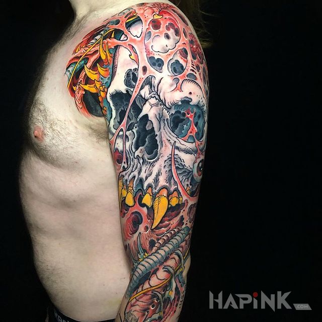 Tattoo Taka inna ta czaszka in colorful motif and graphic / illustrative style On the arm