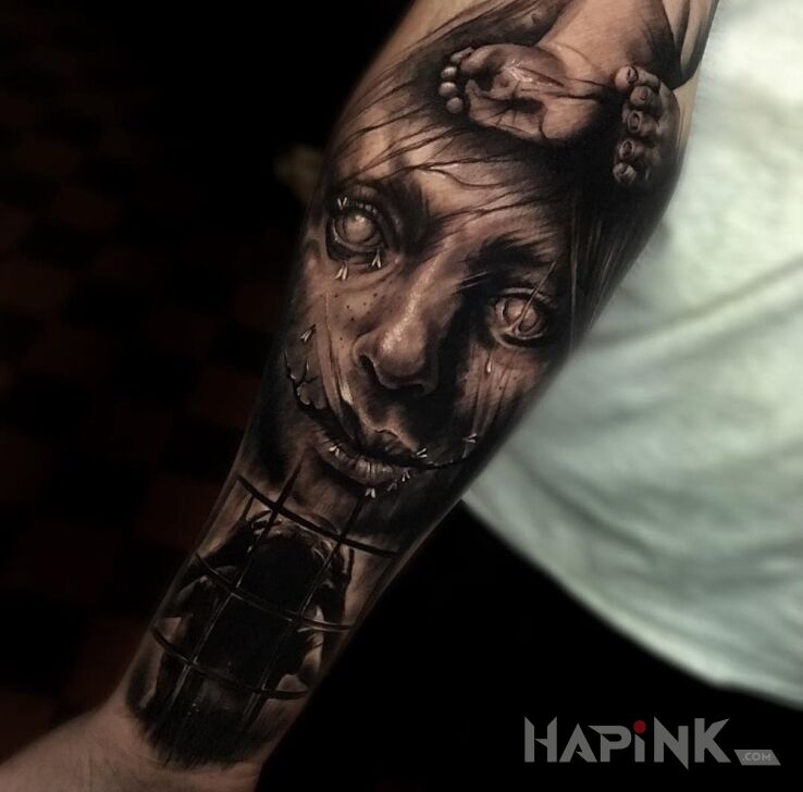 Tattoo Straszny tatuaż in characters motif on the forearm