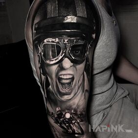 Tattoo Madness on a Motorcycle on the upper arm motif: faces style: realistic