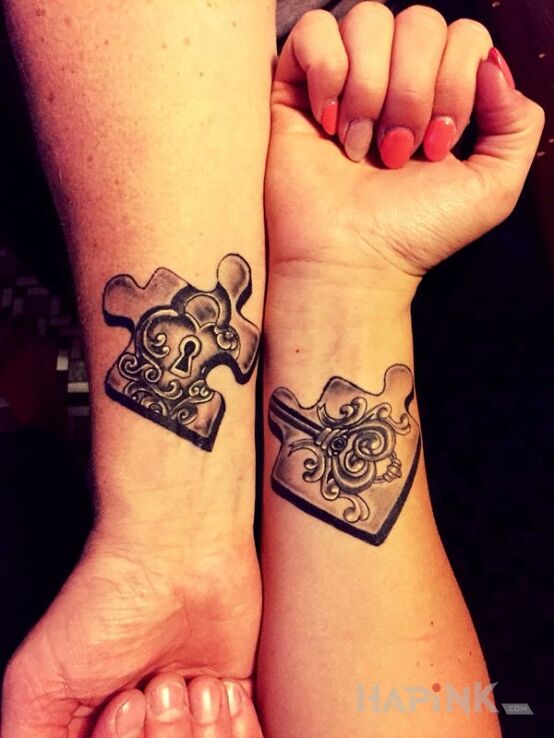 Tattoo Puzzle in Love motif on the forearm