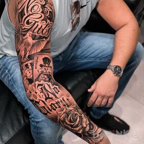 Tattoo No guts no glory on the forearm motif: black and gray style: calligraphy