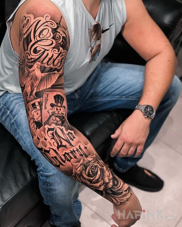 Tattoo No guts no glory in black and gray motif and calligraphy style on the upper arm