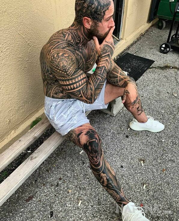 Tattoo Dobry gostek in black and gray motif and Polynesian style on the upper arm