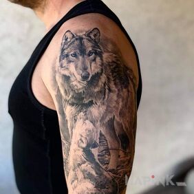 Tattoo Wolf on the upper arm motif: animals style: realistic
