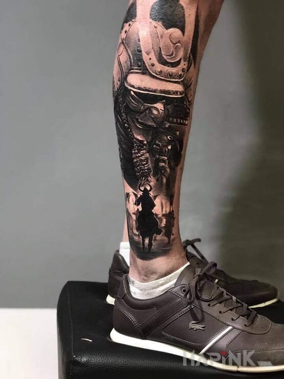 Tattoo Japońskie in black and gray motif and realistic style on the leg
