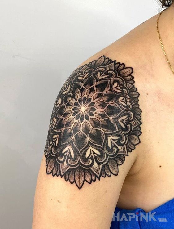 Tattoo Mandale in black and gray motif and graphic / illustrative style on the shoulder