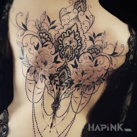 Tattoo Honey Connection on the shoulder blades motif: flowers style: graphic / illustrative