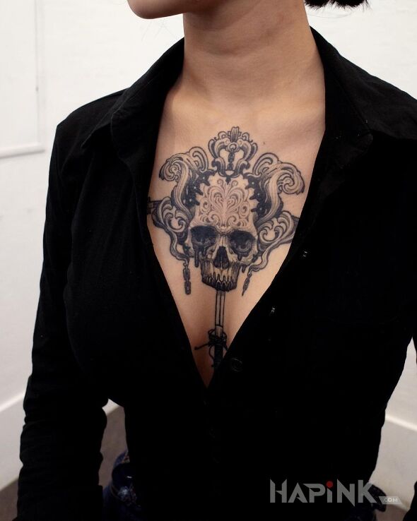 Tattoo Czaszka nabita na sztylet in black and gray motif and graphic / illustrative style on the chest