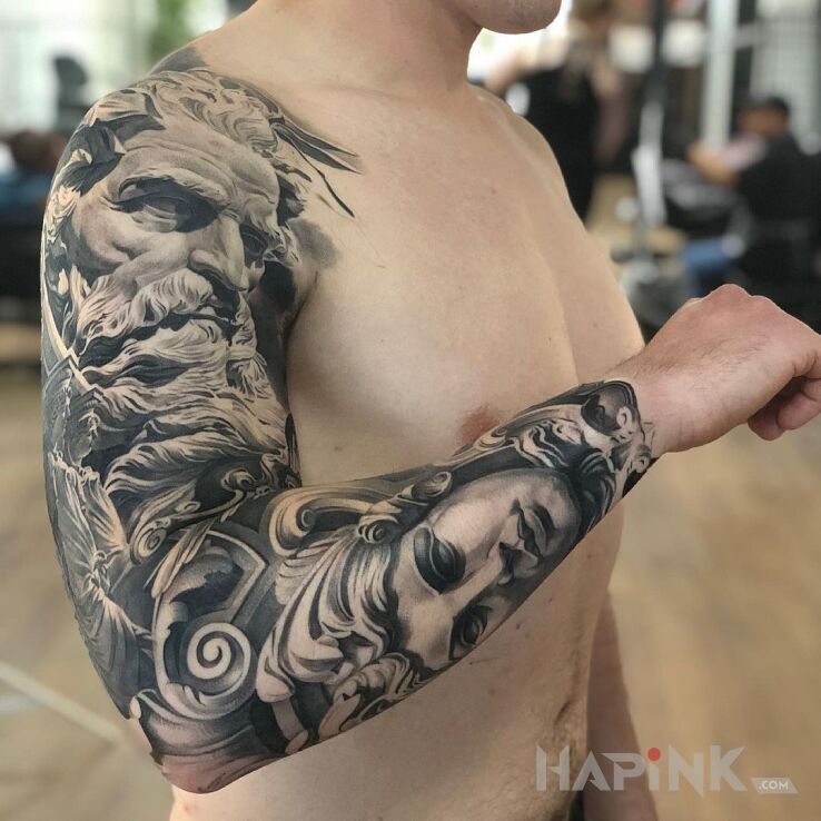 Tattoo Grecki mieszkaniec Olimpu in faces motif and realistic style On the arm