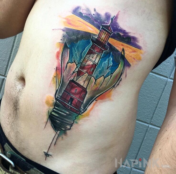 Tattoo Latarnia morska in other motif on the ribs
