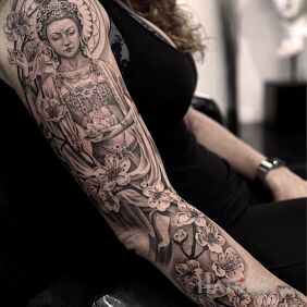 Tattoo Hindu goddess On the arm motif: black and gray style: realistic