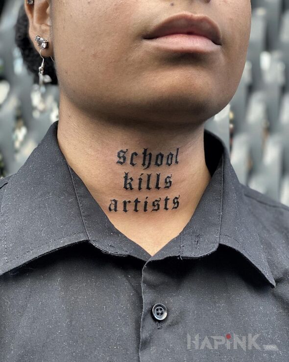 Tattoo Szkoła zabija in lettering motif and calligraphy style on the throat