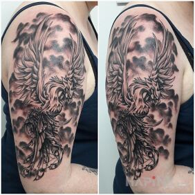Tattoo Phoenix ix on the upper arm motif: black and gray style: graphic / illustrative