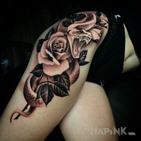Tattoo The snake won't give up its rose on the thigh motif: black and gray style: realistic