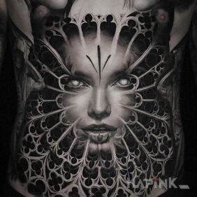 Tattoo Face in stained glass on the stomach motif: Stained glass style: realistic