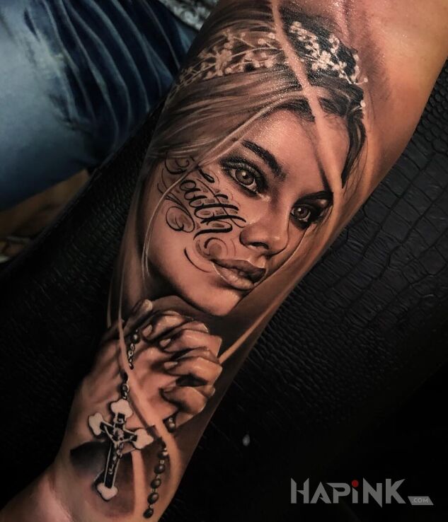 Tattoo Wiara in black and gray motif and realistic style on the forearm