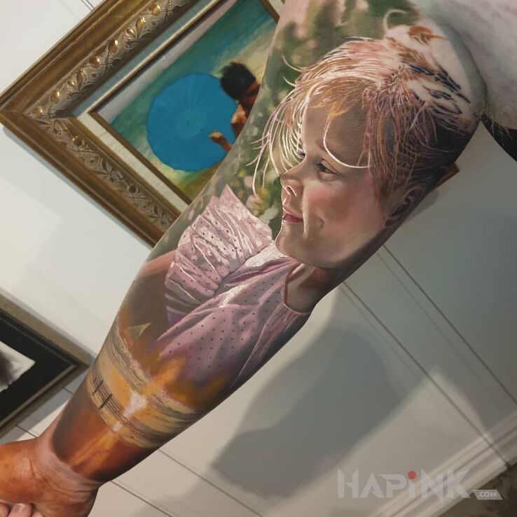 Tattoo Dziewczynka w kolorze in sleeves motif and realistic style on the bicep