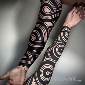 Tattoo Black swirls on the forearm motif: sleeves style: blackwork / blackout