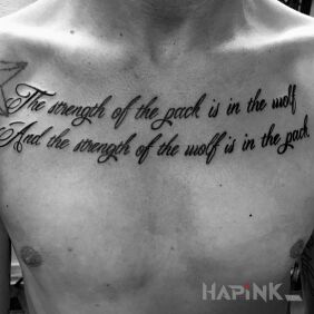 Tattoo The strength of the wolf! on the chest motif: lettering style: calligraphy
