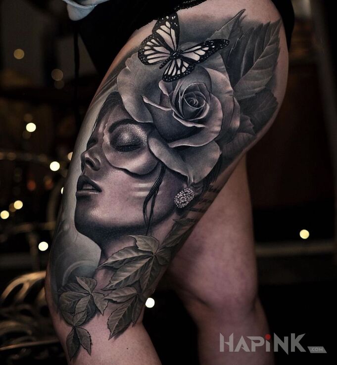 Tattoo Fryz z kwiata in black and gray motif and realistic style on the thigh