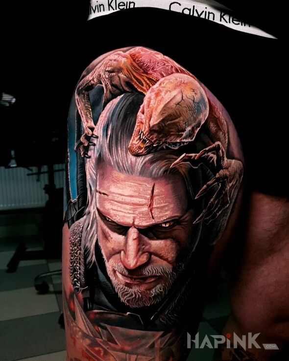 Tattoo Zabójca potworów in faces motif and realistic style on the leg