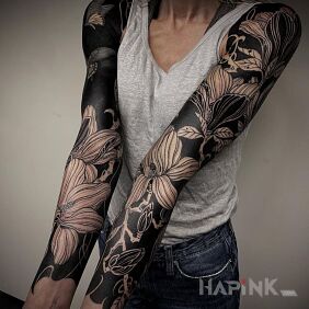 Tattoo Flowers on black background on the forearm motif: flowers style: graphic / illustrative