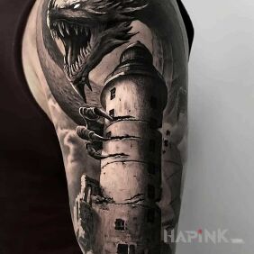 Tattoo Dragon from the Tower on the upper arm motif: black and gray style: realistic