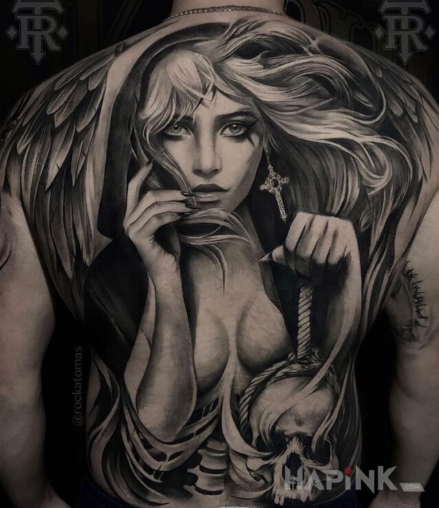 Tattoo Kobieta z czaszką in black and gray motif and realistic style on the shoulder blades