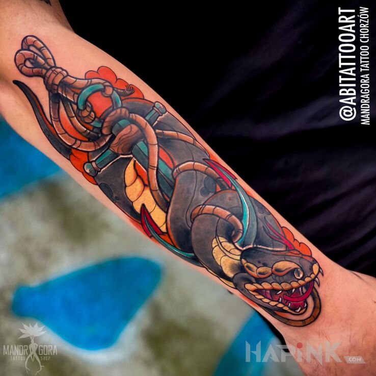 Tattoo Wąż in objects motif and neo-traditional style on the forearm