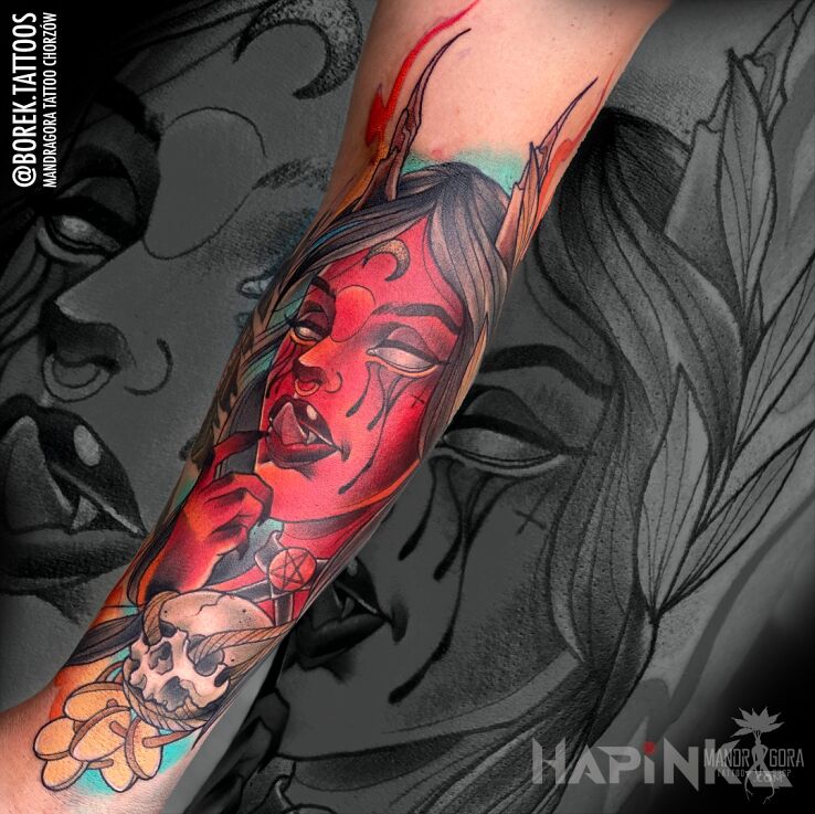 Tattoo Diablica in faces motif and neo-traditional style on the forearm