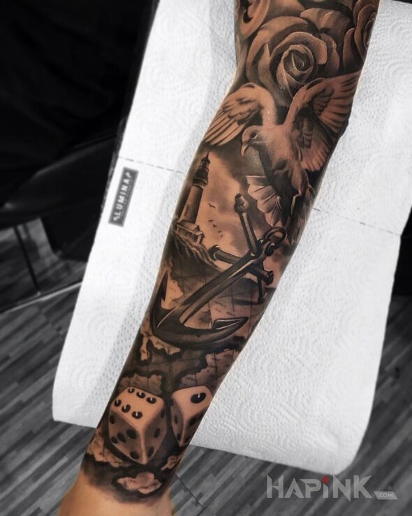 Tattoo Kości do gry i kotwica? czemu nie in flowers motif and realistic style on the forearm