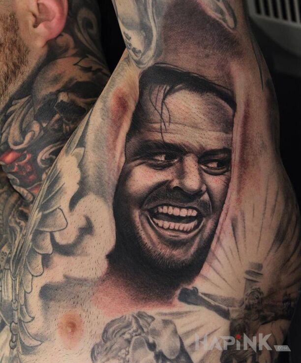 Tattoo Jack nicolson in faces motif and realistic style under the armpit