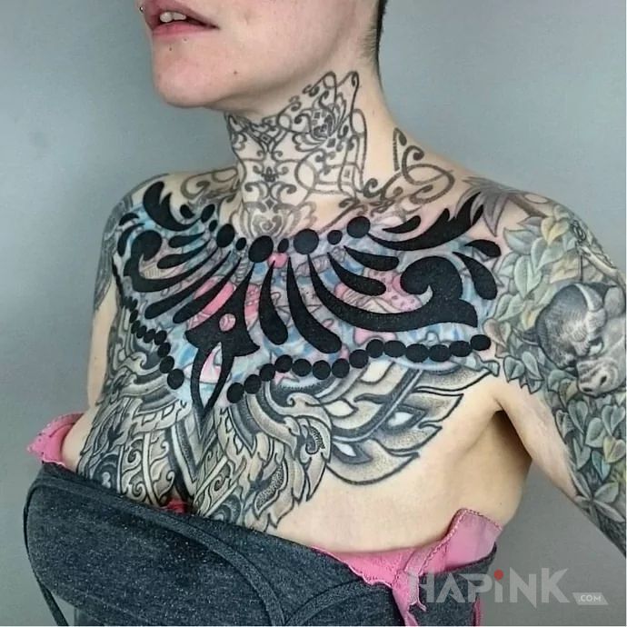 Tattoo Nowa dziara przyklepana in black and gray motif and blast over style on the chest