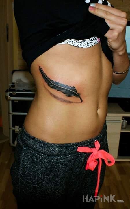 Tattoo Pióro  in other motif on the ribs