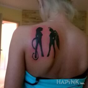 Tattoo That's who I am on the shoulder blades motif: demons