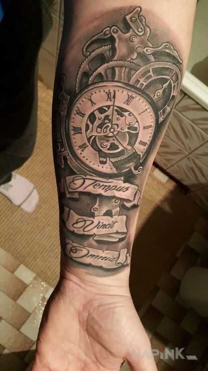 Tattoo Zegar in objects motif on the forearm