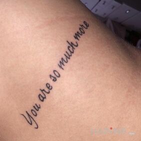 Tattoo You are so much more On the arm motif: lettering style: calligraphy