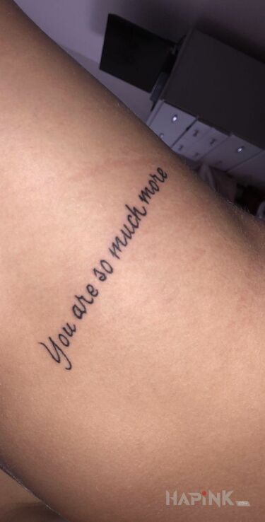 Tattoo Jesteś kimś więcej in lettering motif and calligraphy style On the arm