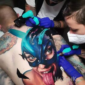 Tattoo Tongue out on the back motif: faces style: realistic