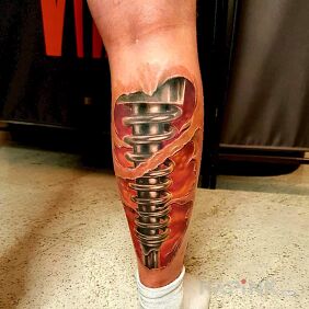 Tattoo Biomechanics on the calf motif: colorful style: biomechanics