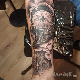 Tattoo Compass on the forearm motif: objects style: realistic