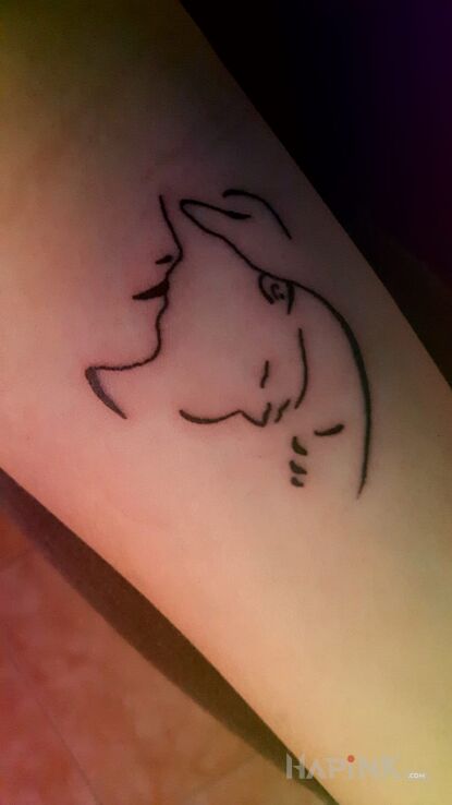Tattoo Matka z maleństwem in Love motif on the forearm